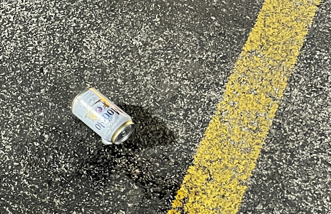 Modelo beer can located with other cans at a parking lot between "Fry the Coop" restaurant and Holiday Inn Express (CARDINAL NEWS)