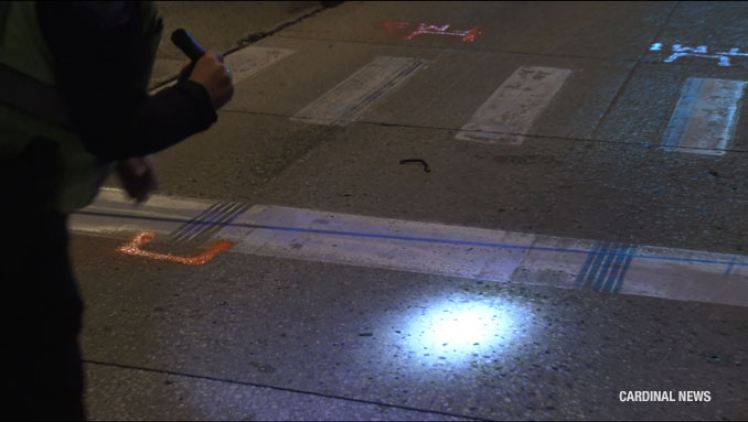 MCAT-STAR investigators discover and examine markings in the northbound lanes of Meacham Road near the crosswalk just south of Biesterfield Road after a fatal crash in Elk Grove Village Tuesday night, May 28, 2024 (CARDINAL NEWS)