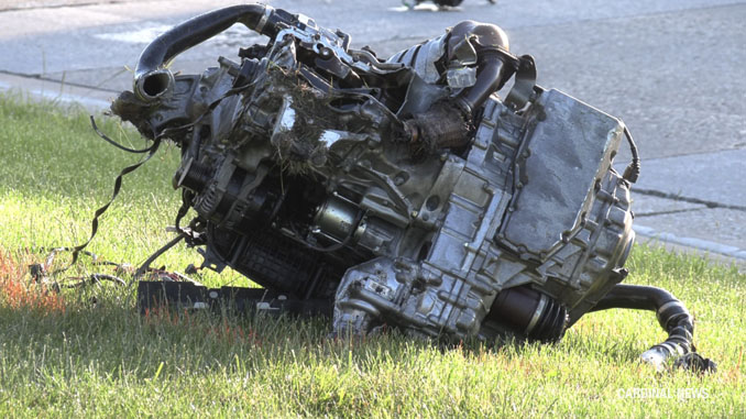 Engine ripped out of Honda SUV by force of crash sits about 225 feet northwest of the Honda SUV with a trail of debris including a vehicle battery and a bumper on the morning after the crash that occurred Tuesday, May 28, 2024 (CARDINAL NEWS)