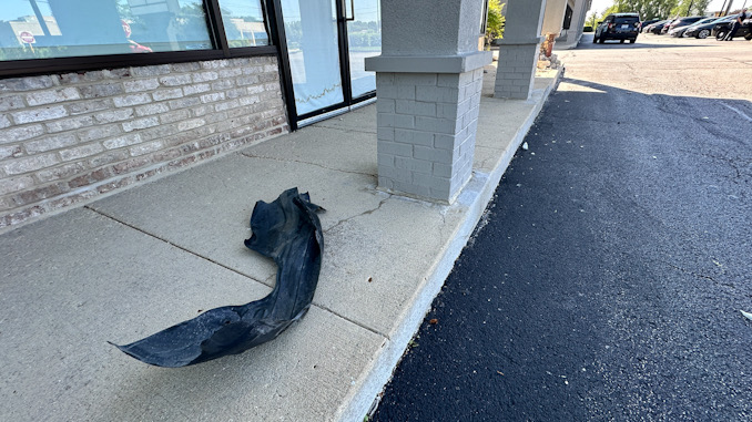 Vehicle part from the Toyota sedan left at the scene at 1060 West Rand Road in Arlington Heights on Tuesday, June 11, 2024 (CARDINAL NEWS)