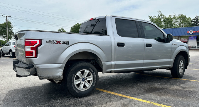 A silver Ford F-150 pickup truck with rear-end damage after a fatal crash involving the pickup truck and a motorcycle on Tuesday, June 4, 2024 on Algonquin Road in Mount Prospect, Illinois (CARDINAL NEWS)