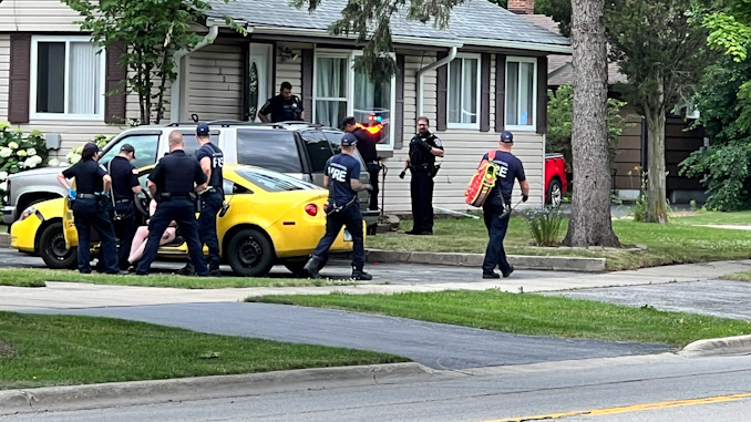 Paramedics evaluate two patients at a domestic battery incident with police on the scene Tuesday, June 18, 2024 (CARDINAL NEWS)