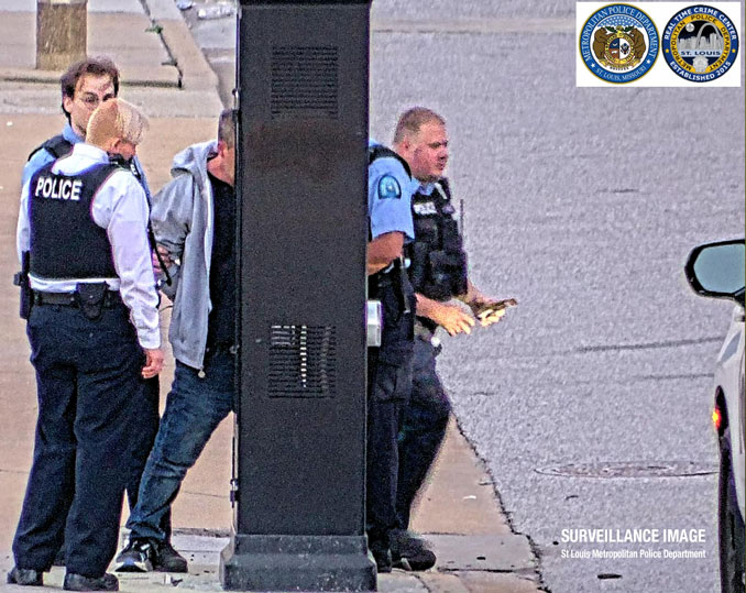 Surveillance image showing suspect Jeffrey Austwick (partially obscured) soon after he was taken into custody near Walnut Street and 7th Street in St. Louis (SOURCE: St. Louis Metropolitan Police Department)