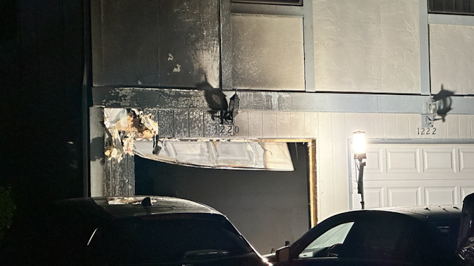 Fire damage to townhouse exterior and attached garage on Inverrary Lane in Palatine on Friday, July 5, 2024 (CARDINAL NEWS)