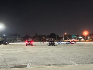 Police officers staged at the Fremd High School parking lot as part of an ILEAS response for Venezuela election protest event at Harper College on Sunday night, July 28, 2024 (CARDINAL NEWS)