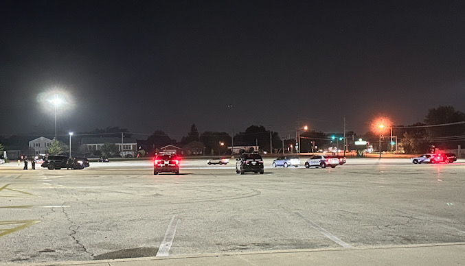 Police officers staged at the Fremd High School parking lot as part of an ILEAS response for Venezuela election protest event at Harper College on Sunday night, July 28, 2024 (CARDINAL NEWS)