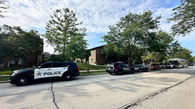 Major Case Assistance Team van (far right) and Arlington Heights police vehicle on scene of a shooting death investigation in the block of 4200 North Bloomington Avenue in Arlington Heights on Sunday, July 21, 2024 (CARDINAL NEWS)