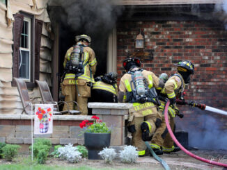 Firefighters working at extinguishing a fatal garage fire at house on Woodhollow Lane in Buffalo Grove on Monday, July 22, 2024 (PHOTO CREDIT: John J. Kleeman)