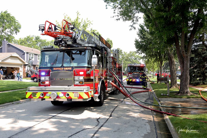 Fire equipment on the street at a fatal garage fire at house on Woodhollow Lane in Buffalo Grove on Monday, July 22, 2024 (PHOTO CREDIT: John J. Kleeman)