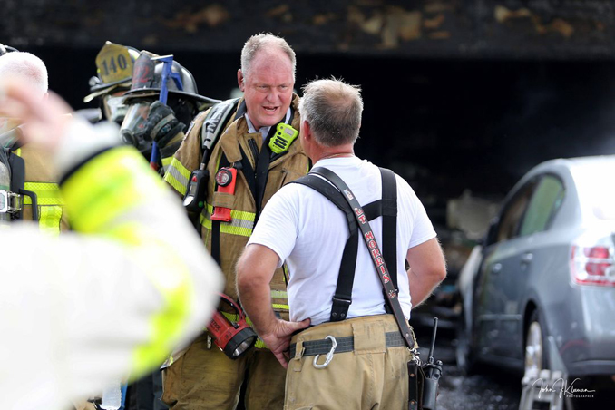 Firefighters on scene at a fatal garage fire at house on Woodhollow Lane in Buffalo Grove on Monday, July 22, 2024 (PHOTO CREDIT: John J. Kleeman)