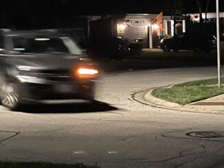 Suspects' gray minivan fleeing the scene without headlights on, and making a left turn from southbound Haddow Avenue to eastbound Hawthorne Street after a residential burglary on Haddow Avenue in Arlington Heights (provided photo for CARDINAL NEWS)