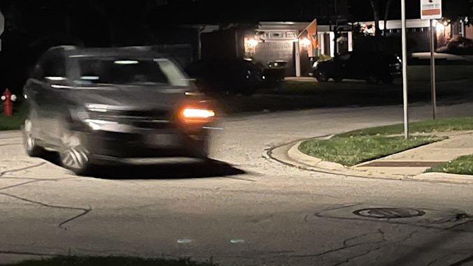 Suspects' gray minivan fleeing the scene without headlights on, and making a left turn from southbound Haddow Avenue to eastbound Hawthorne Street after a residential burglary on Haddow Avenue in Arlington Heights (provided photo for CARDINAL NEWS)