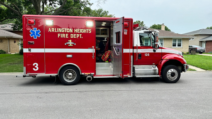 Paramedics in Arlington Heights Fire Department Ambulance 3 assessing a patient before transport to Northwest Community Hospital in Arlington Heights (CARDINAL NEWS)