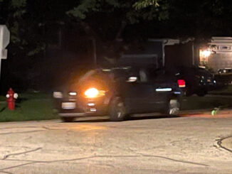 Suspects' gray minivan fleeing the scene without headlights on after a residential burglary on Haddow Avenue in Arlington Heights (provided photo for CARDINAL NEWS)