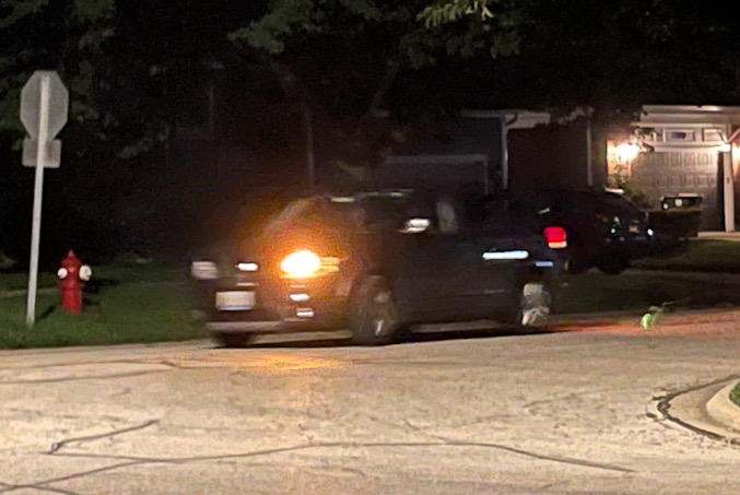 Suspects' gray minivan fleeing the scene without headlights on after a residential burglary on Haddow Avenue in Arlington Heights (provided photo for CARDINAL NEWS)