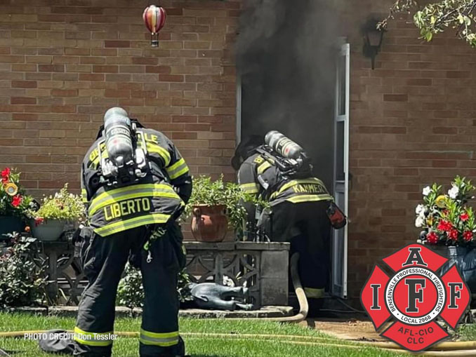 Firefighters with SCBA and entry to a house fire on Medinah Street in Bensenville Monday, July 15, 2024 (PHOTO CREDIT: Don Tessler/Bensenville Professional Firefighters Local 2968)