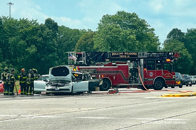 Rear-end crash with fire and one hurt in the eastbound lanes of Golf Road near Busse Woods (PHOTO CREDIT: Scott Jamieson)