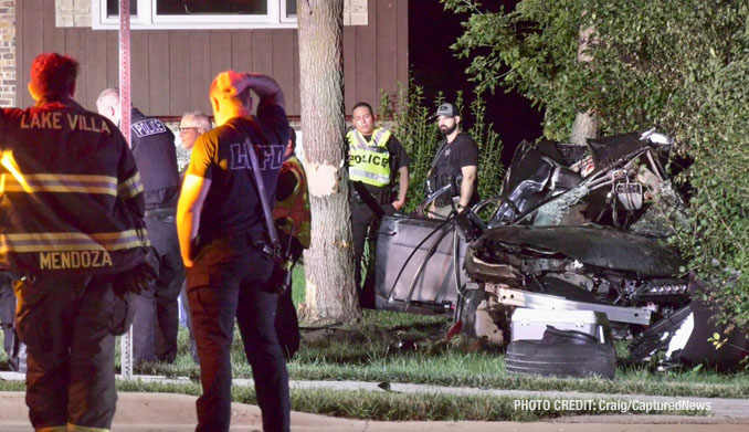 Firefighters, paramedics and police officers on the scene of a fatal crash on Grand Avenue near Prospect Drive in Lindenhurst (PHOTO CREDIT: Craig/CapturedNews)