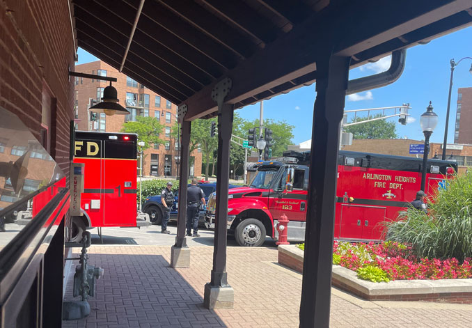 Police and paramedics at an apparent psychiatric emergency with a man on the railroad tracks at the Metra train station on Thursday, July 18, 2024 (PHOTO CREDIT: Jim E.)