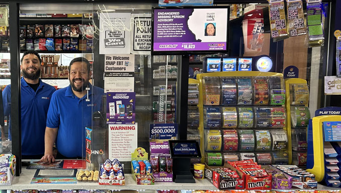 Jackpaul Singh (left), owner of ARCO, located at 2758 W. Peterson Ave. in Chicago, celebrates with longtime employee Alfonso Perez, the cashier who sold a $1 million winning lottery ticket (SOURCE: Illinois Lottery)