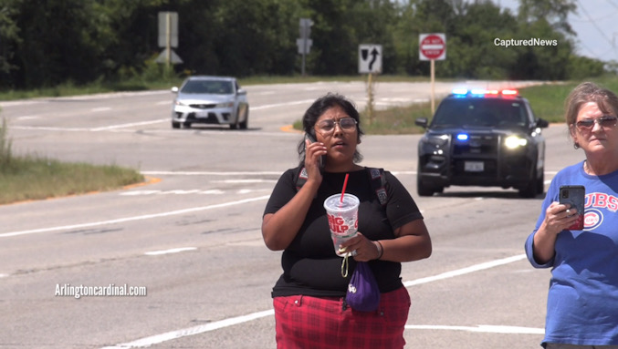 Suspect drinking a Big Gulp on the shoulder of Route 14 near the Speedway in Lake Barrington while police were arriving to search for her and the homicide suspect she had been accompanying Tuesday, August 20, 2024 (CARDINAL NEWS)