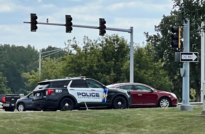 Crystal Lake Police Department on the grass parkway near Portillo's at Route 14 and Route 31 on the look out for the blue Chevrolet pickup truck at 12:40 p.m. just before the pickup truck was located at the Swiss Automation parking lot in Lake Barrington about 12:42 p.m. Tuesday (CARDINAL NEWS)