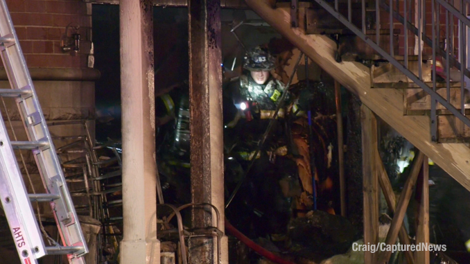 Firefighters working interior after the fire was extinguished on Crambourne Way in Arlington Heights, Friday, August 9, 2024 (Craig/CapturedNews)