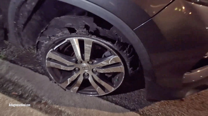 A shredded tire, passenger front, on a Honda Pilot at a traffic stop Saturday night, August 17, 2024 (CARDINAL NEWS)