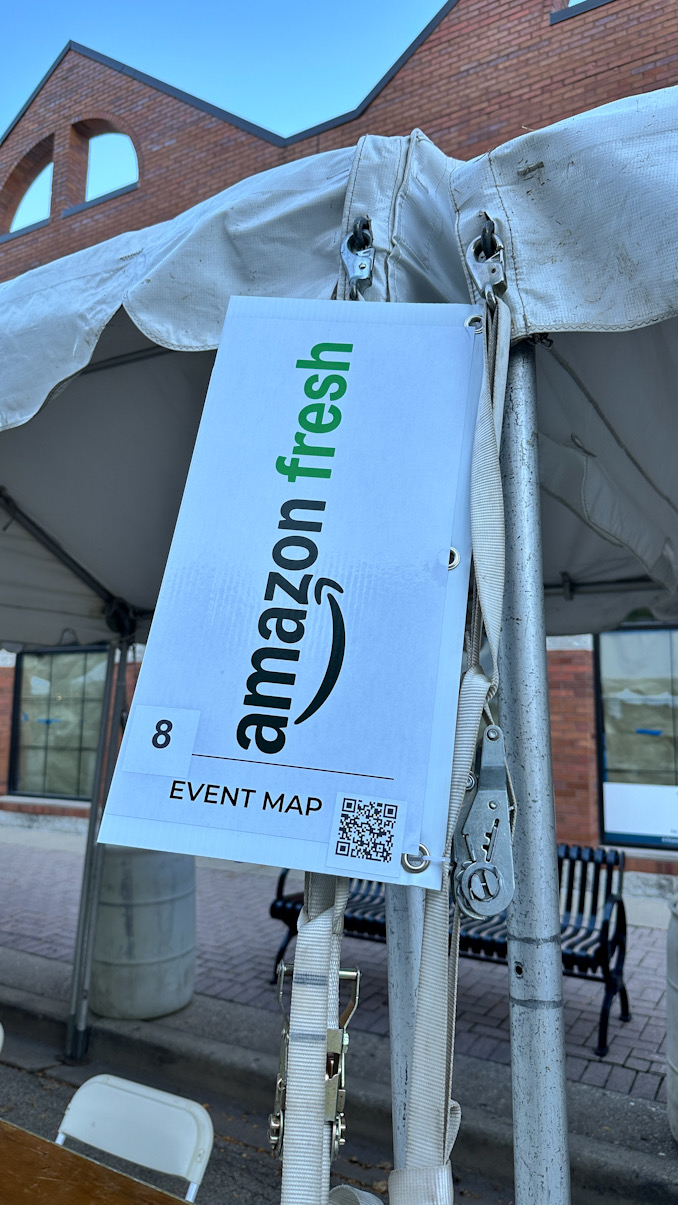 Amazon, representing the new store at Palatine Road and Arlington Height Road has a booth on Vail Avenue just north of Cortland's Garage