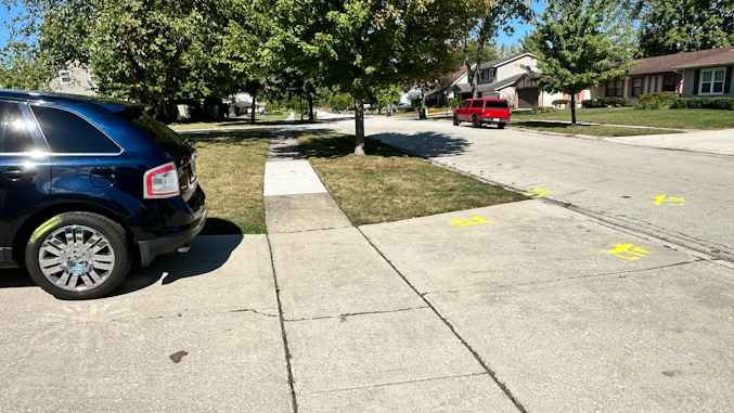 Driveway and sidewalk where a woman was apparently run over by her own SUV on her driveway on Wednesday, September 25, 2024 (CARDINAL NEWS)