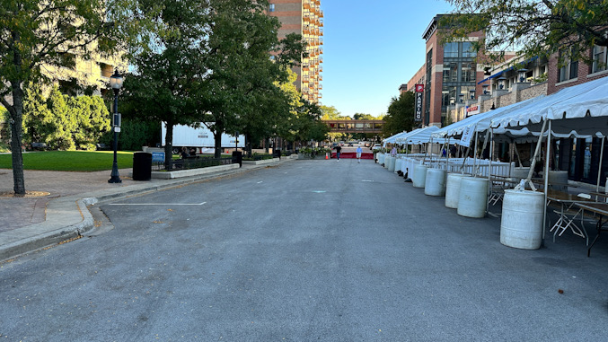 Setup for Taste of Arlington at 2024 Harmony Fest in downtown Arlington Heights looking south on Vail Avenue near Campbell Street