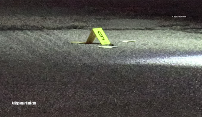 Evidence marker next to a shell casing after two were shot outside at an apartment complex in the block of 1700 Chariot Court in Mount Prospect, Friday, September 6, 2024 (CARDINAL NEWS)