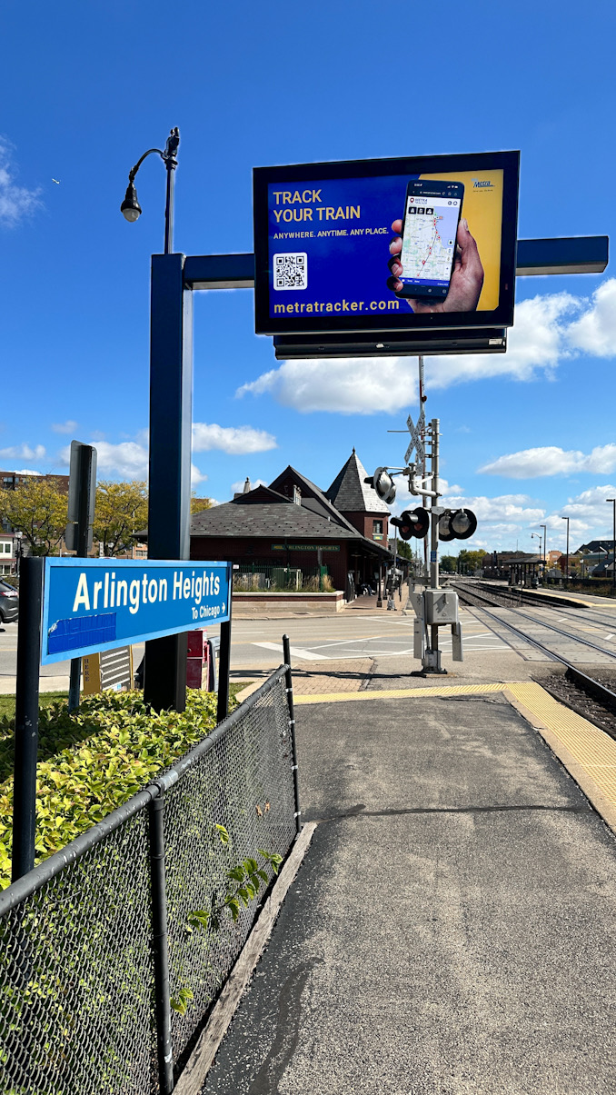 Message board (looking inbound to Chicago) at downtown Arlington Heights Metra train station frozen on train tracker display on September 30, 2024 (CARDINAL NEWS)