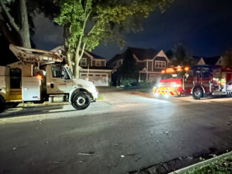 ComEd crew and Arlington Heights Fire Department Engine 2 crew in the block of 900 North Beverly Avenue in Arlington Heights after a transformer blew Friday night, September 27, 2024 (CARDINAL NEWS)