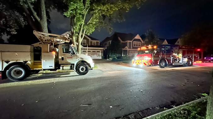 ComEd crew and Arlington Heights Fire Department Engine 2 crew in the block of 900 North Beverly Avenue in Arlington Heights after a transformer blew Friday night, September 27, 2024 (CARDINAL NEWS)