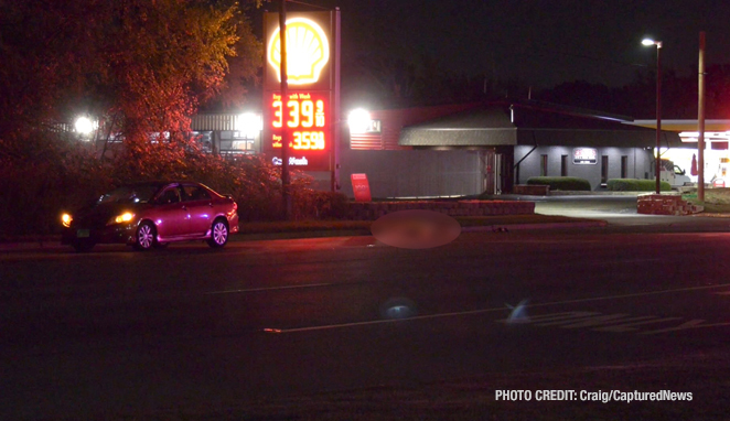 The driver of a red 4-door sedan remained at the scene after a fatal vehicle vs pedestrian crash on Friday night, October 18, 2024 (PHOTO CREDIT: Craig/CapturedNews)