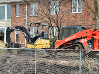 Excavators at the scene where an underground power line was hit during property maintenance at a condo townhouse neighborhood on Douglas Court in Arlington Heights (CARDINAL NEWS)