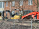 Excavators at the scene where an underground power line was hit during property maintenance at a condo townhouse neighborhood on Douglas Court in Arlington Heights (CARDINAL NEWS)