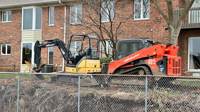 Excavators at the scene where an underground power line was hit during property maintenance at a condo townhouse neighborhood on Douglas Court in Arlington Heights (CARDINAL NEWS)