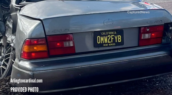 California license plate found affixed to the rear of a Lexus sedan run over by a semi-trailer truck at Rand Road and Palatine Road in Arlington Heights, Tuesday morning, November 12, 2024 (Provided video for CARDINAL NEWS)