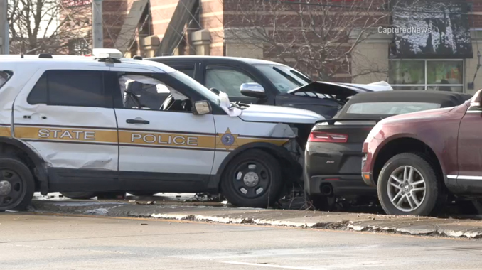 Illinois State Police vehicle sideswiped by black Toyota Tacoma (PHOTO CREDIT: CapturedNews)